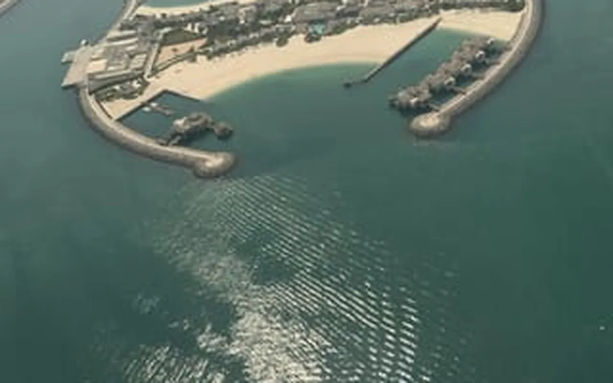 The fronds of Palm Jumeirah seen from a helicopter over Dubai