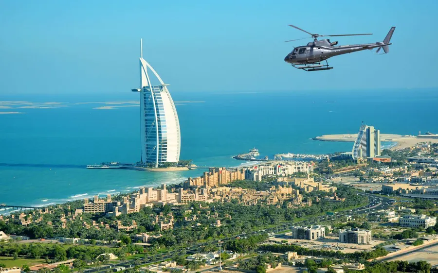 The old quarter of Dubai with wind towers and an abra on the Creek
