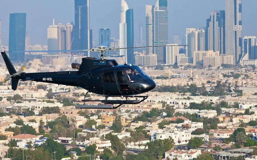 A helicopter over the sea near the Burj Al Arab in Dubai